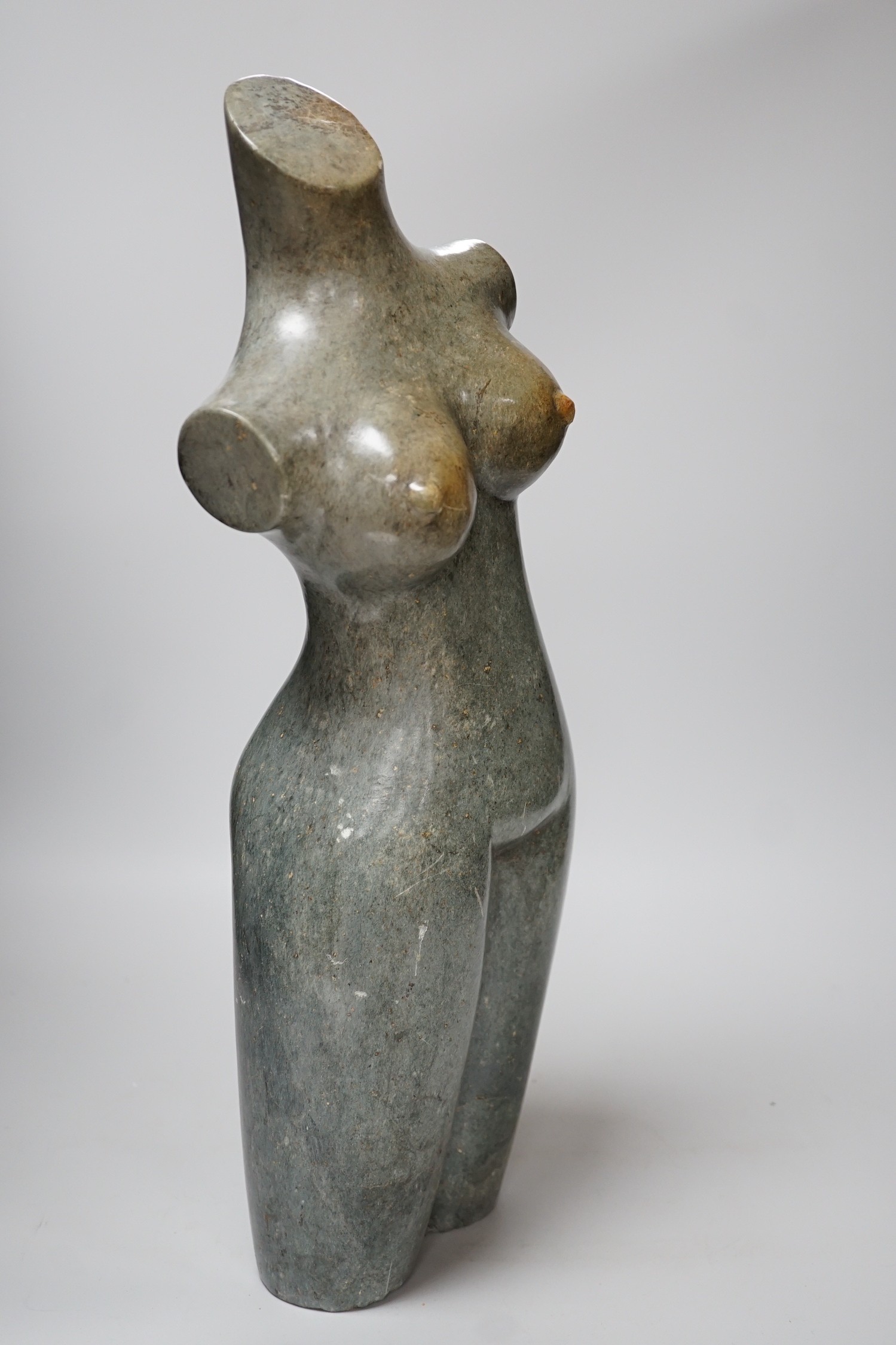 Daniel Baradza (Zimbabwean). A large carved stone female torso, 52cms high